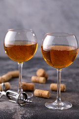 Two glasses with white wine on a textural background. Copy space. Place for your text.