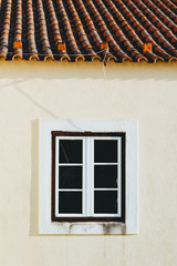White window with a red roof