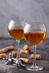 Two glasses with white wine on a textural background. Copy space. Place for your text.