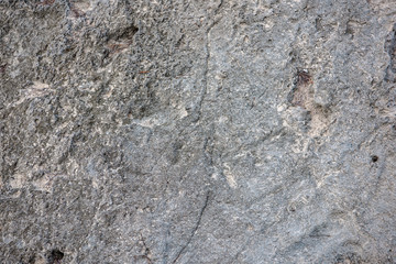 Stone texture of a monolithic, natural stone. Closeup.