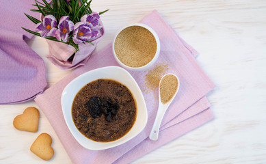 flowers , cookies and porridge of amaranth with prunes