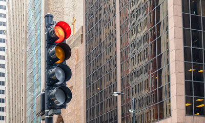 Red traffic lights for cars, office buildings background, Chicago city, Illinois