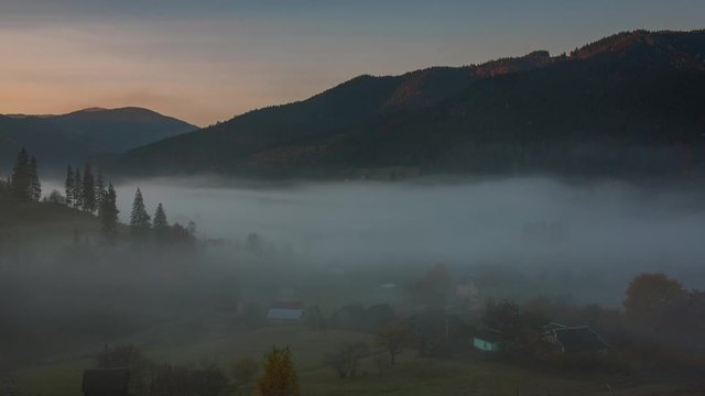 Time lapse of the morning fog covering valley in Carpathian mountains, Ukraine