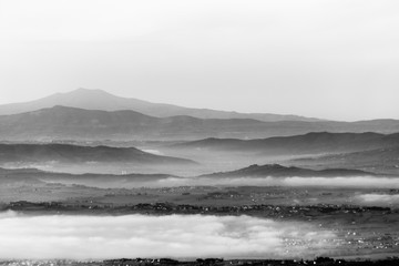 A view of Umbria valley with hills and mist