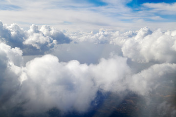 Obraz na płótnie Canvas Take aerial photos of the sea of clouds on the plane.
