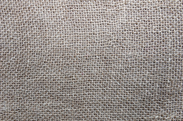 Natural linen texture for the background in beige color. Canvas, burlap