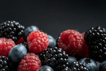 Macro view of mix with ripe blueberry, blackberry and raspberry fruits