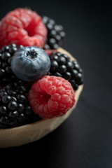 Macro view of mix with ripe blueberry, blackberry and raspberry fruits