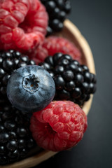 Macro view of mix with ripe blueberry, blackberry and raspberry fruits
