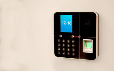 Closeup of bio metric finger print sensor equipment to control access or movement or attendance in places such as offices,hospitals                 