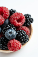 Macro view of mix with ripe blueberry, blackberry and raspberry fruits