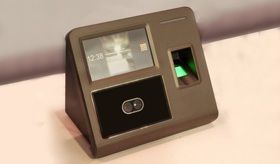 Closeup of bio metric finger print sensor equipment to control access or movement or attendance in places such as offices,hospitals        
