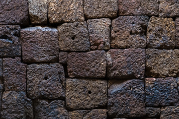 Old laterite brick wall for background.