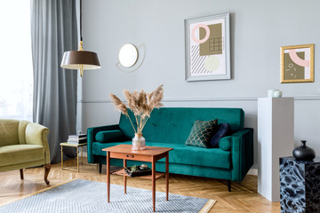 Minimalist interior design with sofa, coffee table and framed posters