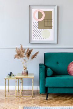 Minimalist interior design with sofa and framed posters