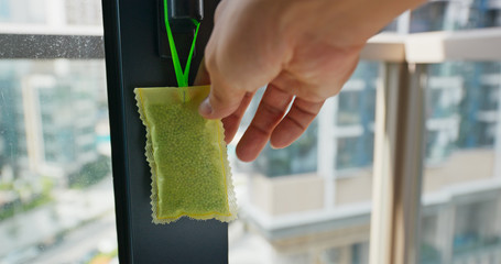 Hanging a pack of the refresher for Mosquito Repellent