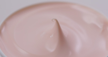 Pink cosmetics lotion close up