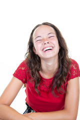 Young cheerful happy girl teen smiling laughing at camera in white background