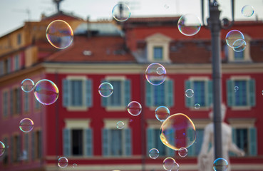 soap bubbles flying through the streets of the city