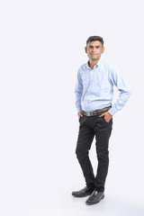 young indian man Standing over white background