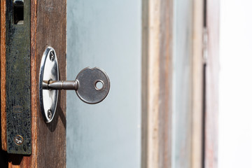 A key for lock or unlock wooden door texture, Close up & Macro shot, Selective focus, Security concept