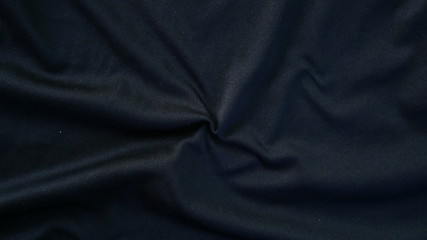 Fototapeta na wymiar black cotton fabric background, texture of sportswear shirt