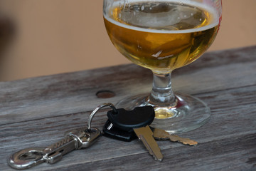 Drinking and driving - Vehicle keys near a glass beer