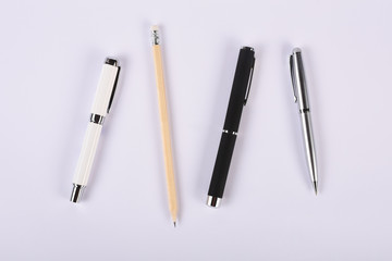 Fototapeta premium Group of writing instrument, pen, pencil, fountain pen, ballpoint pen