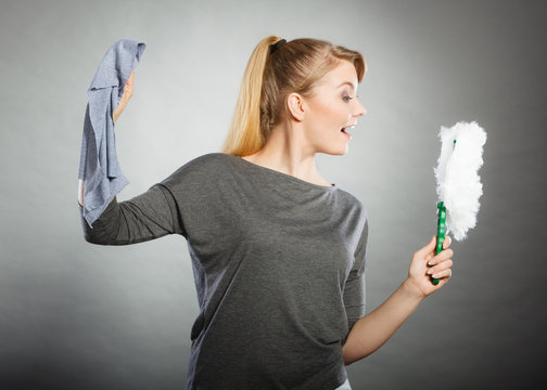 Cheerful lady with household items.
