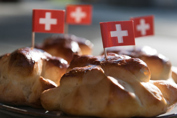Swiss National Day, August 1st, special bread rolls with a small Swiss flag on top