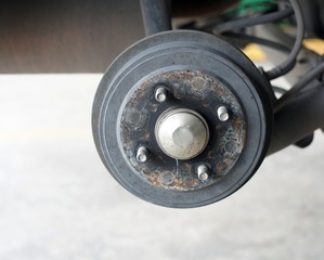 A rear right wheel axle of the car.