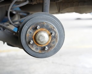 A rear left wheel axle of the car.