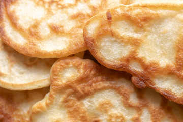 fresh pancakes on a glass dish. authentic homemade food. background backdrop.