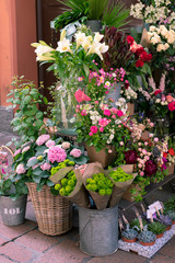 A variety of flowers on a street exhibition of flower shop, Italy.