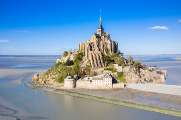 Fototapeta na wymiar The famous of top view with blue sky at Mont-Saint-Michel, Normandy, France