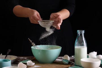 Cook in the kitchen. Making dough for cupcakes. Cooking process, cook hands