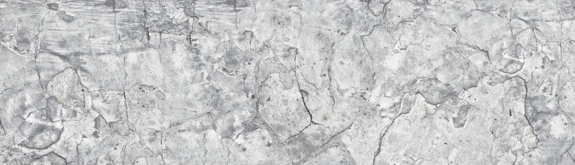 Wide old light gray shabby concrete wall. Broken cement surface texture panorama. Long grunge...