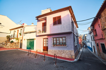 Fototapeta na wymiar DENIA, SPAIN - JUNE 19, 2019: Old town of Denia with narrow streets and coloured houses.
