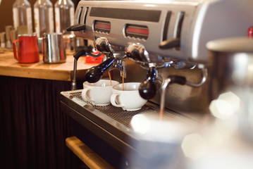 Fototapeta na wymiar Barista make coffee latte art with espresso machine in cafe.