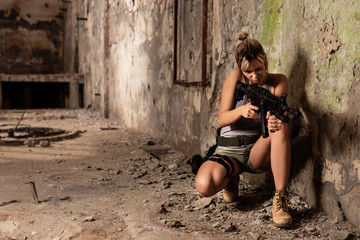 Young woman playing war game indoors