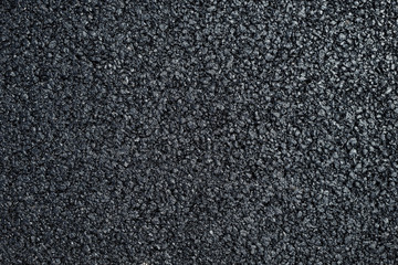 A new dark grey asphalt pavement texture.