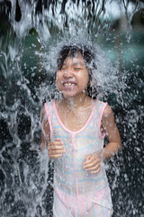 Fototapeta premium Asian Little Chinese Girl playing at water park
