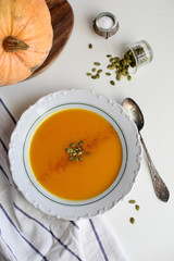 pumpkin soup puree on light background