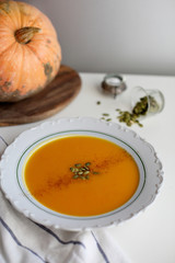 pumpkin soup puree on light background