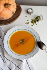 pumpkin soup puree on light background
