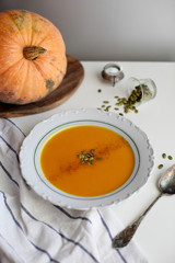 pumpkin soup puree on light background