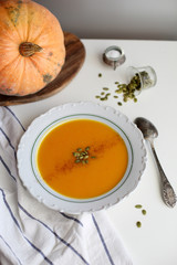 pumpkin soup puree on light background
