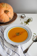 pumpkin soup puree on light background