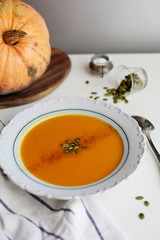 pumpkin soup puree on light background