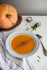 pumpkin soup puree on light background
